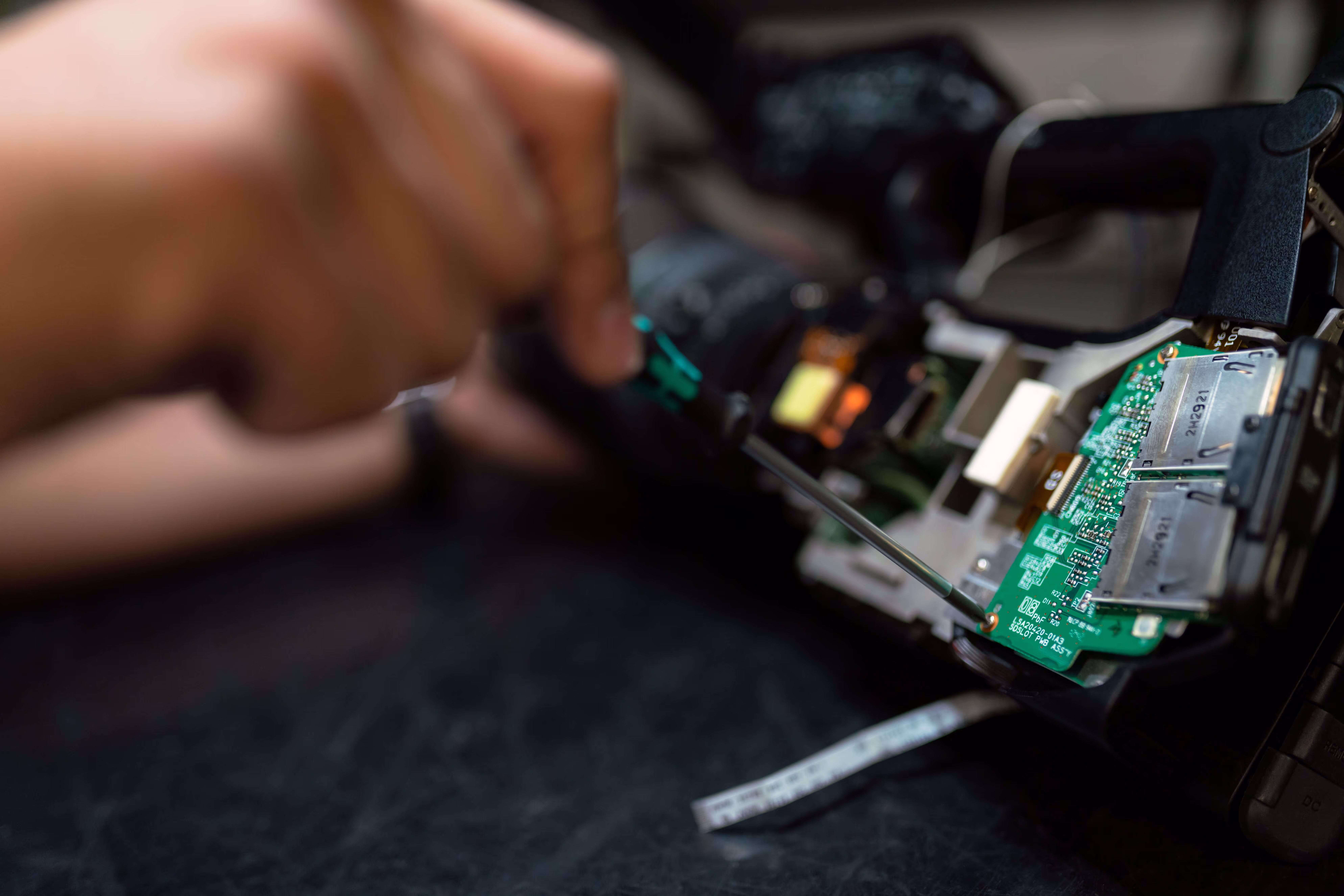 engineer working on circuit board.